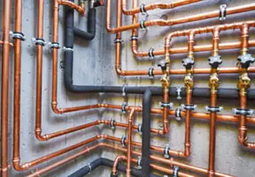 Complex commercial plumbing setup with copper piping